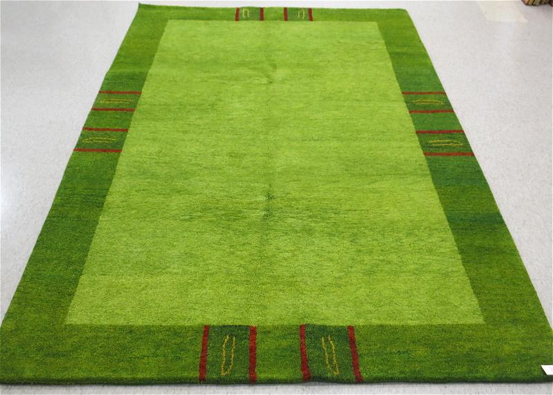 Appraisal: HAND KNOTTED ORIENTAL CARPET Indo-Gabbeh plain rectangular light green field