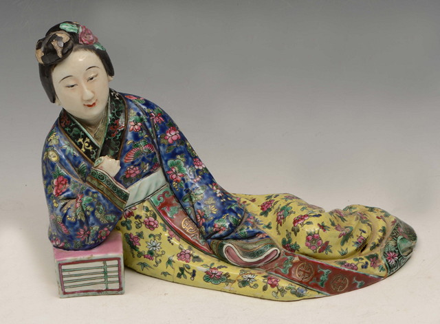 Appraisal: A CHINESE FIGURE OF A RECLINING LADY with floral decorated