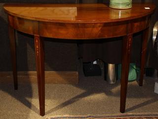 Appraisal: Pair of demi-lune console tables executed in mahogany with light