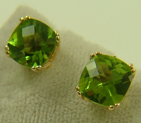 Appraisal: PAIR OF PERIDOT AND FOURTEEN KARAT GOLD EARRINGS each with