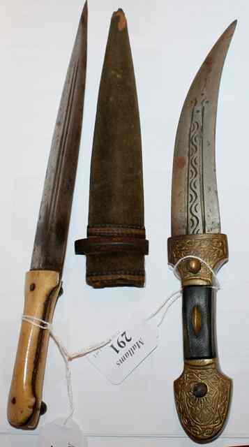 Appraisal: A MIDDLE EASTERN DAGGER with a shaped bone handle with