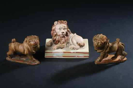 Appraisal: STAFFORDSHIRE PEARLWARE FIGURE OF RECUMBENT LION Circa On a rectangular