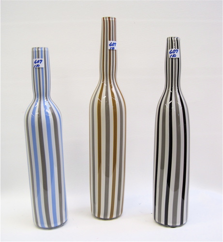 Appraisal: THREE ITALIAN DECORATOR BOTTLES each with vertical striping Height of