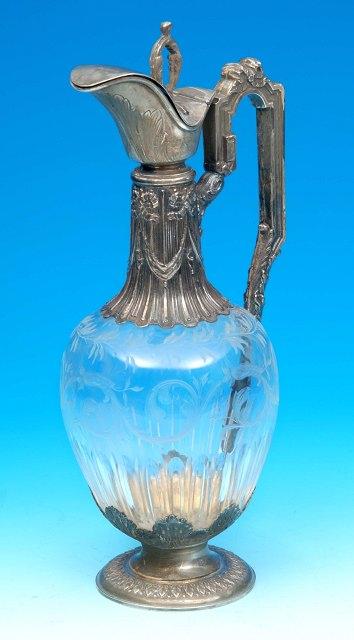 Appraisal: A French cut glass and white metal mounted claret jug