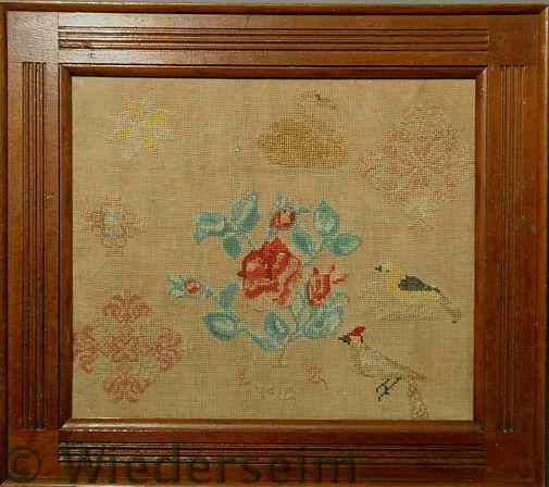 Appraisal: Needlework of a spray of roses surrounded by birds star