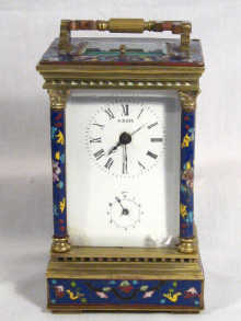 Appraisal: A cloisonne and ormolu cased carriage alarm clock the white