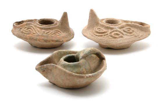 Appraisal: Near Pair of Roman Pottery Oil Lamps of typical form