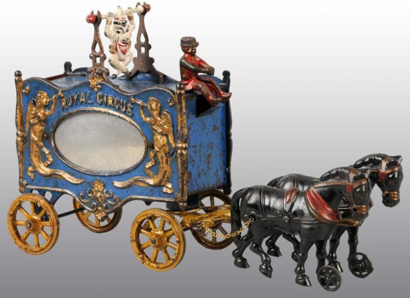 Appraisal: Cast Iron -Horse Royal Circus Trapeze Wagon Toy Description Includes