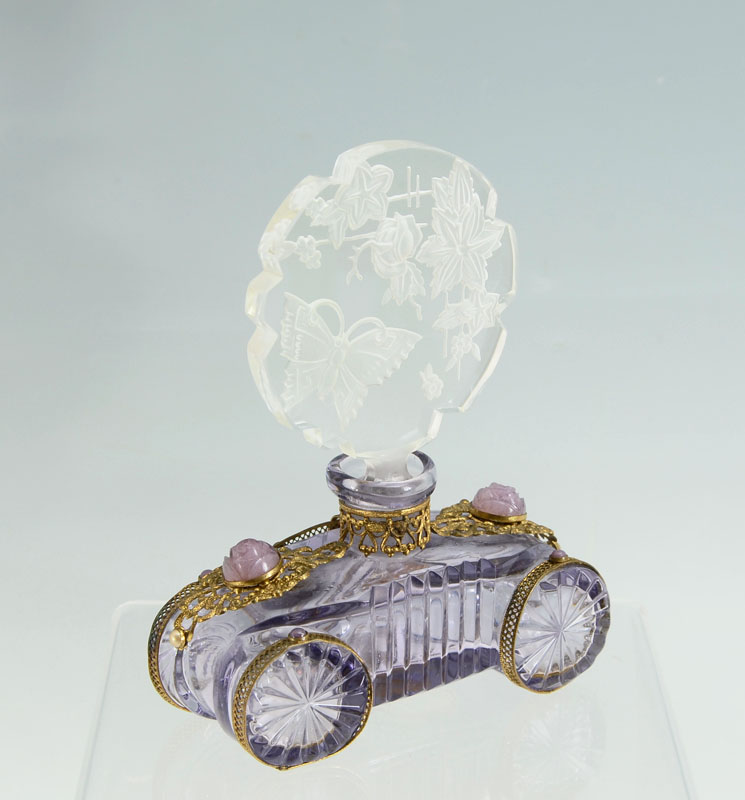 Appraisal: MORLEE JEWELED AMETHYST GLASS PERFUME BOTTLE Figural car form molded