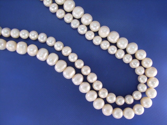 Appraisal: A mm fresh water pearl necklace with a silver clasp