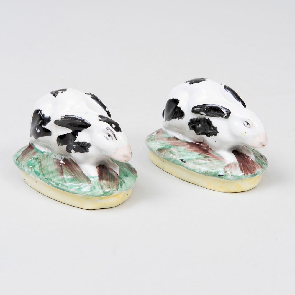 Appraisal: Pair of Staffordshire Pottery Models of Recumbent Hares in long