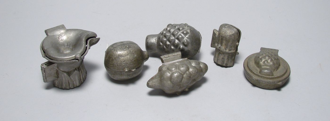 Appraisal: SIX VINTAGE PEWTER ICE CREAM MOLDS Pineapple on tart pineapple