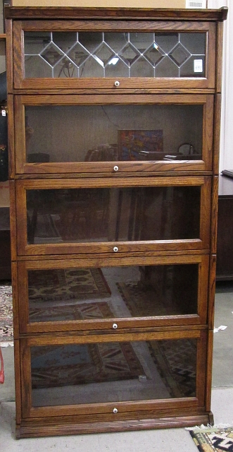 Appraisal: STACKING OAK BOOKCASE American antique reproduction featuring five horizontal sections