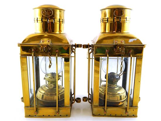 Appraisal: Two brass lanterns each containing fluid lamps fitted with glass