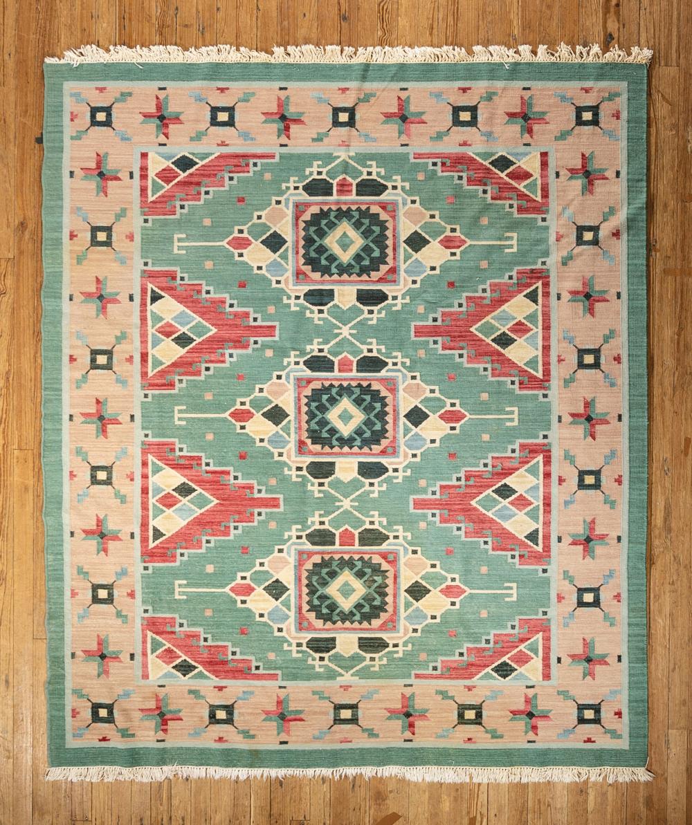 Appraisal: Dhurrie Rug teal and red ground geometric design ft in