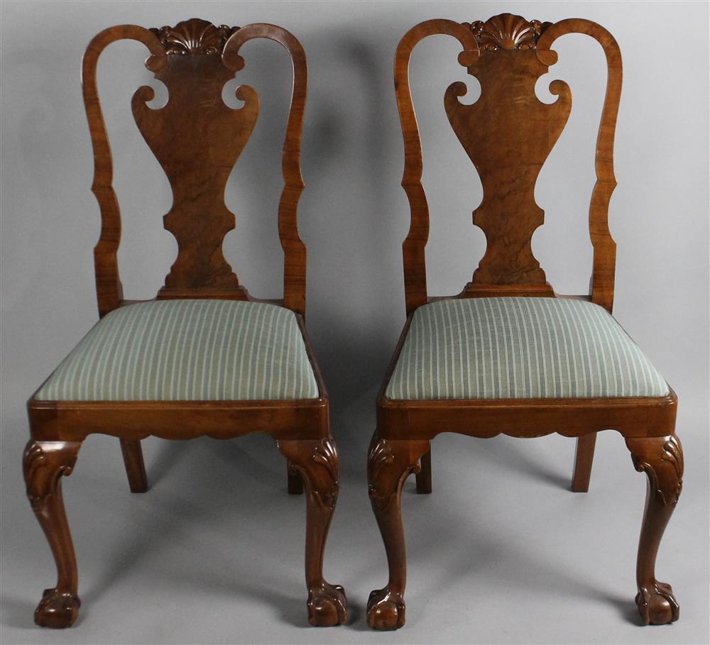 Appraisal: PAIR OF QUEEN ANNE STYLE CARVED DINING CHAIRS having a