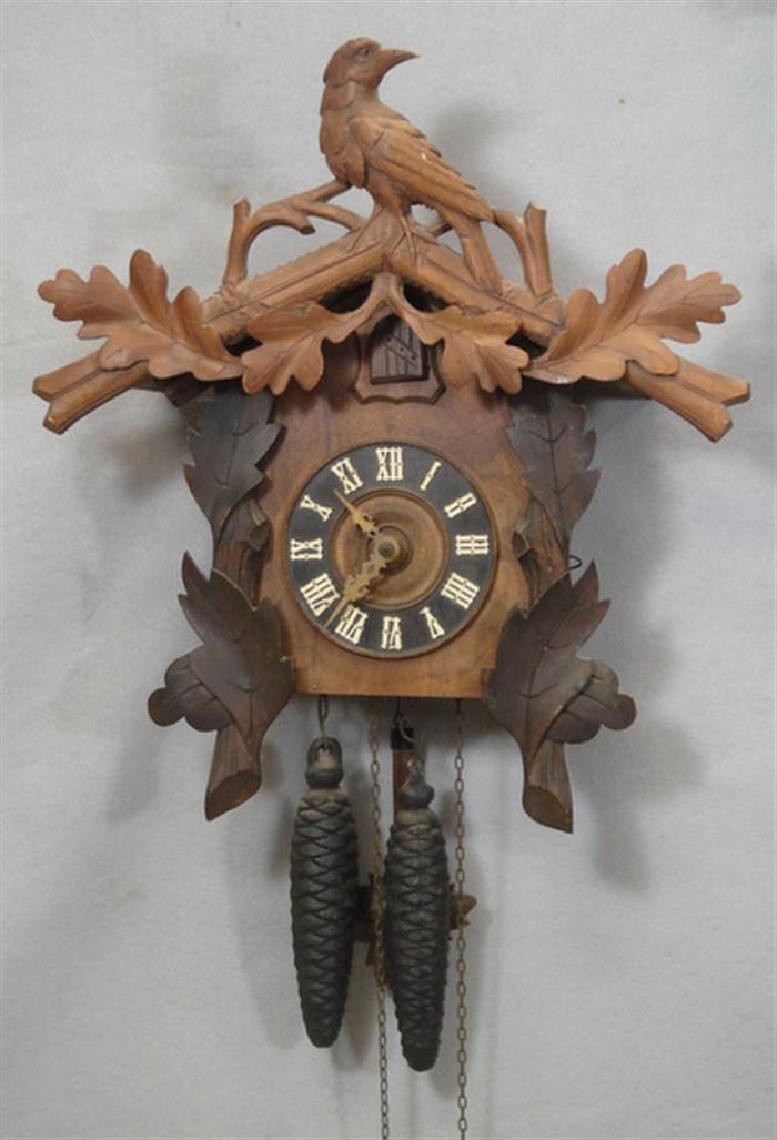 Appraisal: Carved Black Forest cuckoo clock bird oak leaf crest weights