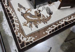 Appraisal: Tibetan rug in the Chinesee taste having two dragons flanking