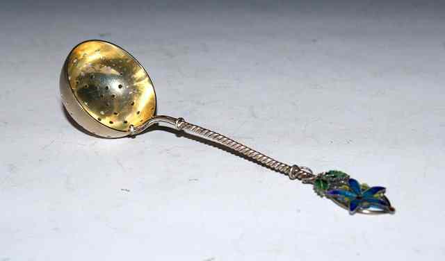 Appraisal: A NORWEGIAN SILVER AND PLIQUE A JOUR SIFTER SPOON with