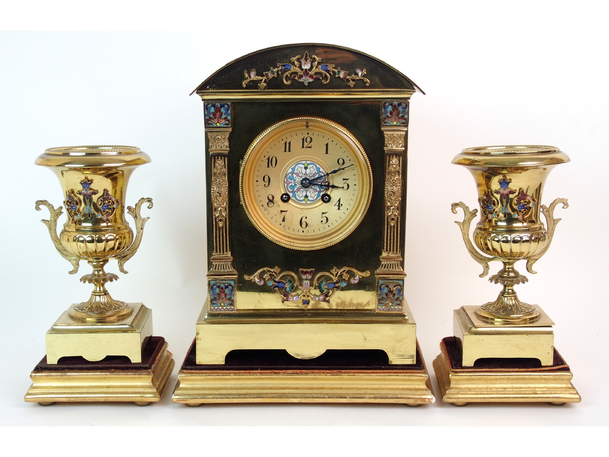 Appraisal: A French brass and enamelled three-piece clock garniturecomprising mantle clock