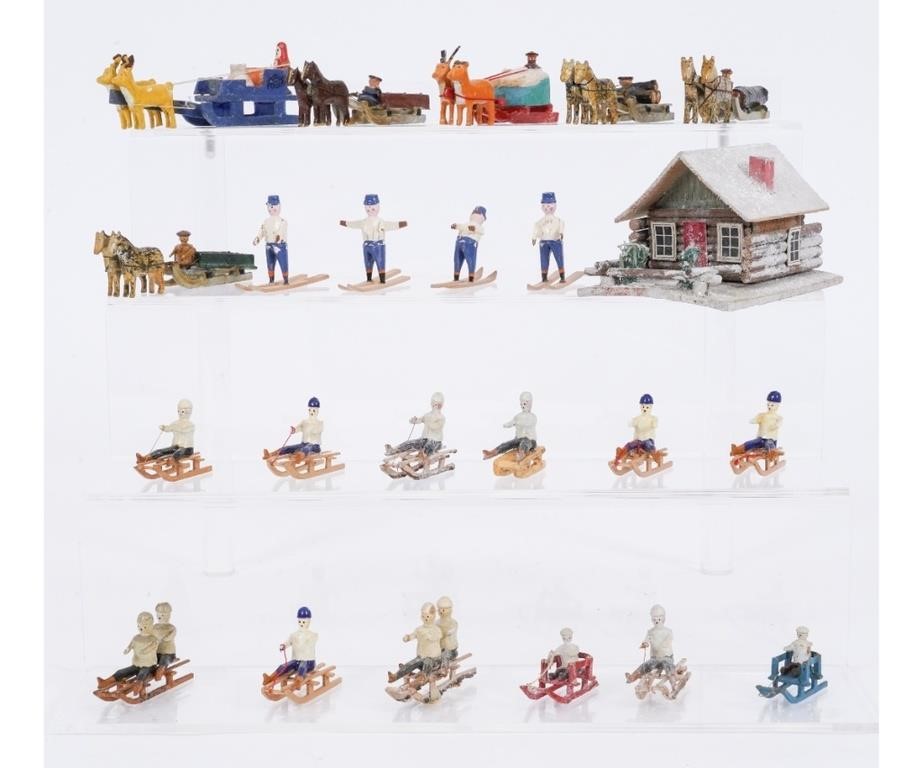 Appraisal: Six horse drawn wagons on skis twelve sleds with figures