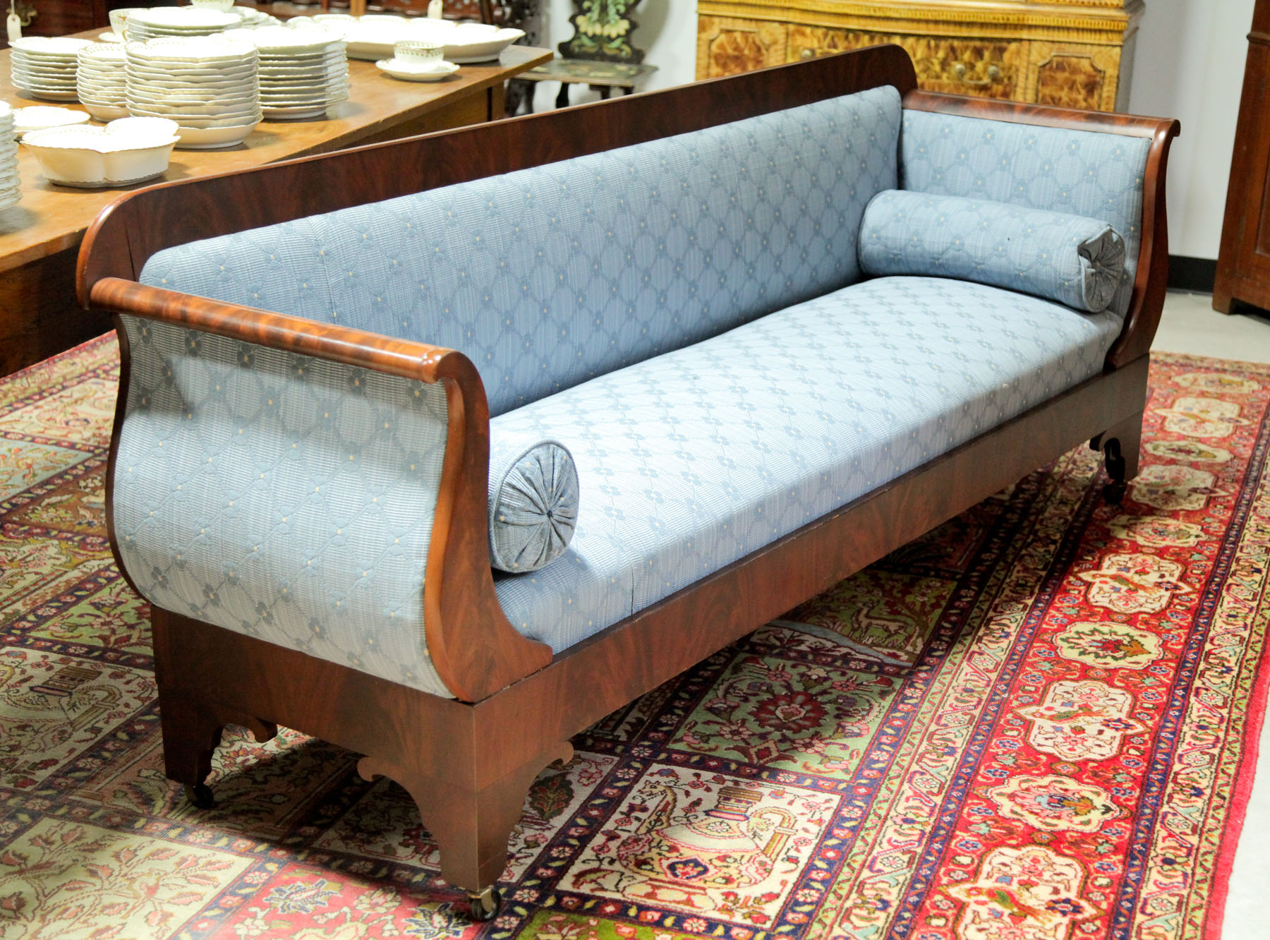 Appraisal: EMPIRE STYLE SOFA American early th century Flame grain mahogany