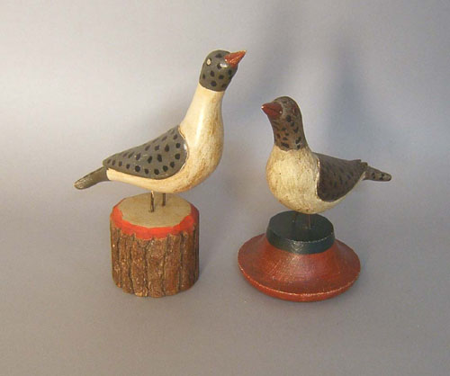 Appraisal: Two carved and painted birds in the manner of Simmons