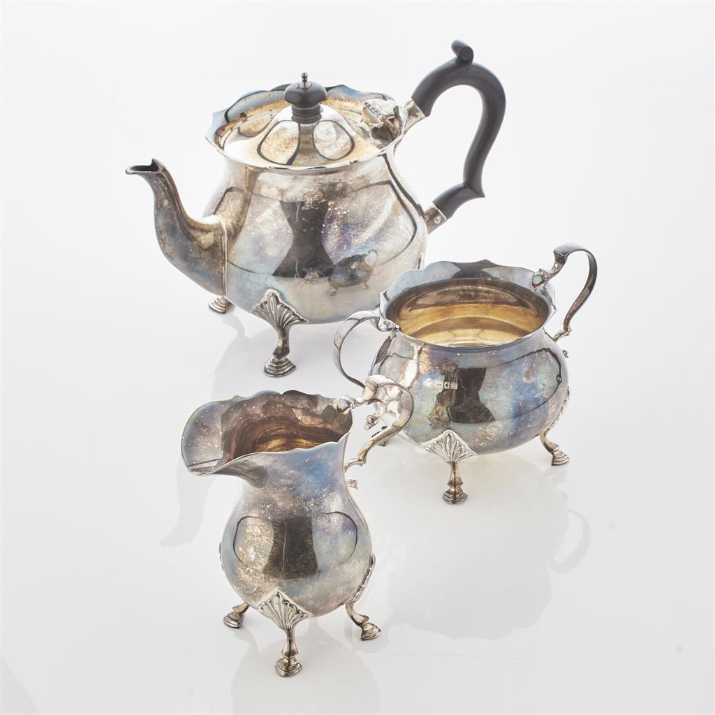 Appraisal: A three piece silver tea service JR London of rounded