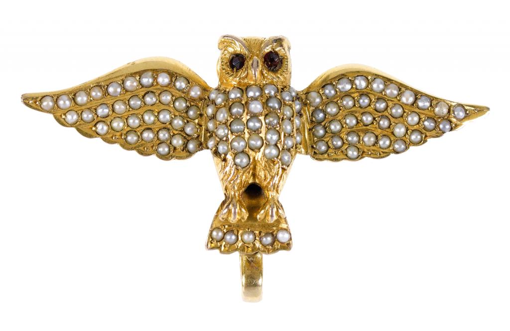 Appraisal: A GOLD OWL BROOCH with red stone eyes seed pearl