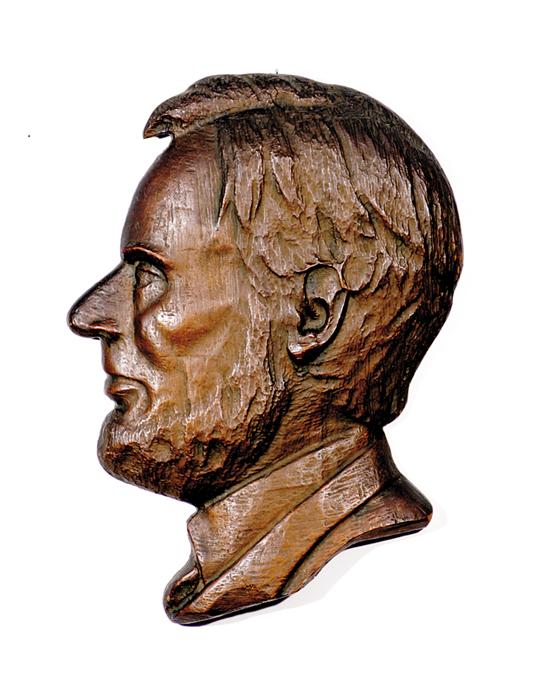 Appraisal: Folk art carved Abraham Lincoln profile signed dated lower rim