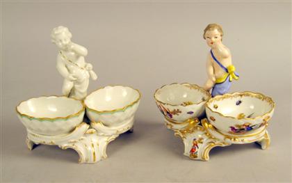 Appraisal: Two KPM porcelain figural salts Each with a putto with