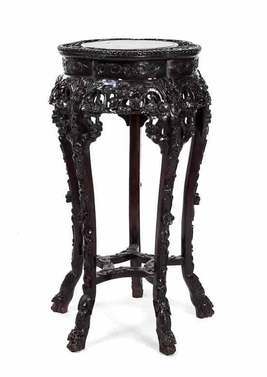 Appraisal: A Carved Hardwood Chinese Stand having a marble inset top