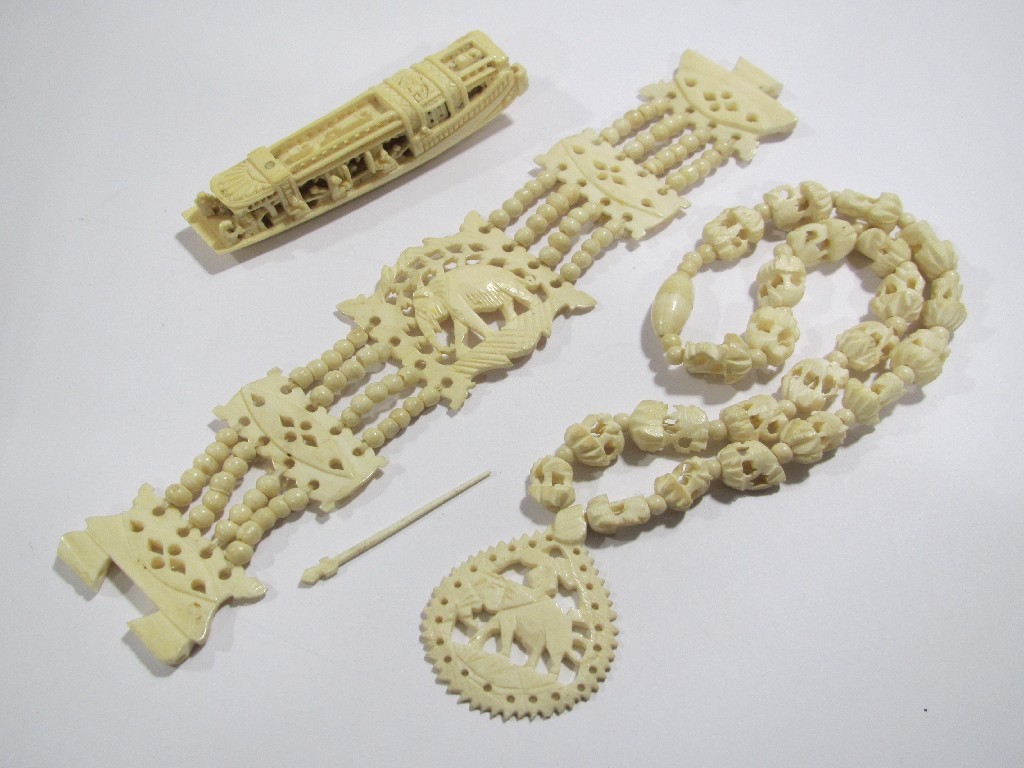 Appraisal: Lot comprising carved ivory bracelet and necklace depicting elephants and