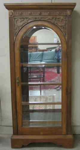 Appraisal: A HARDWOOD AND BEVELED GLASS CURIO DISPLAY CABINET recent The