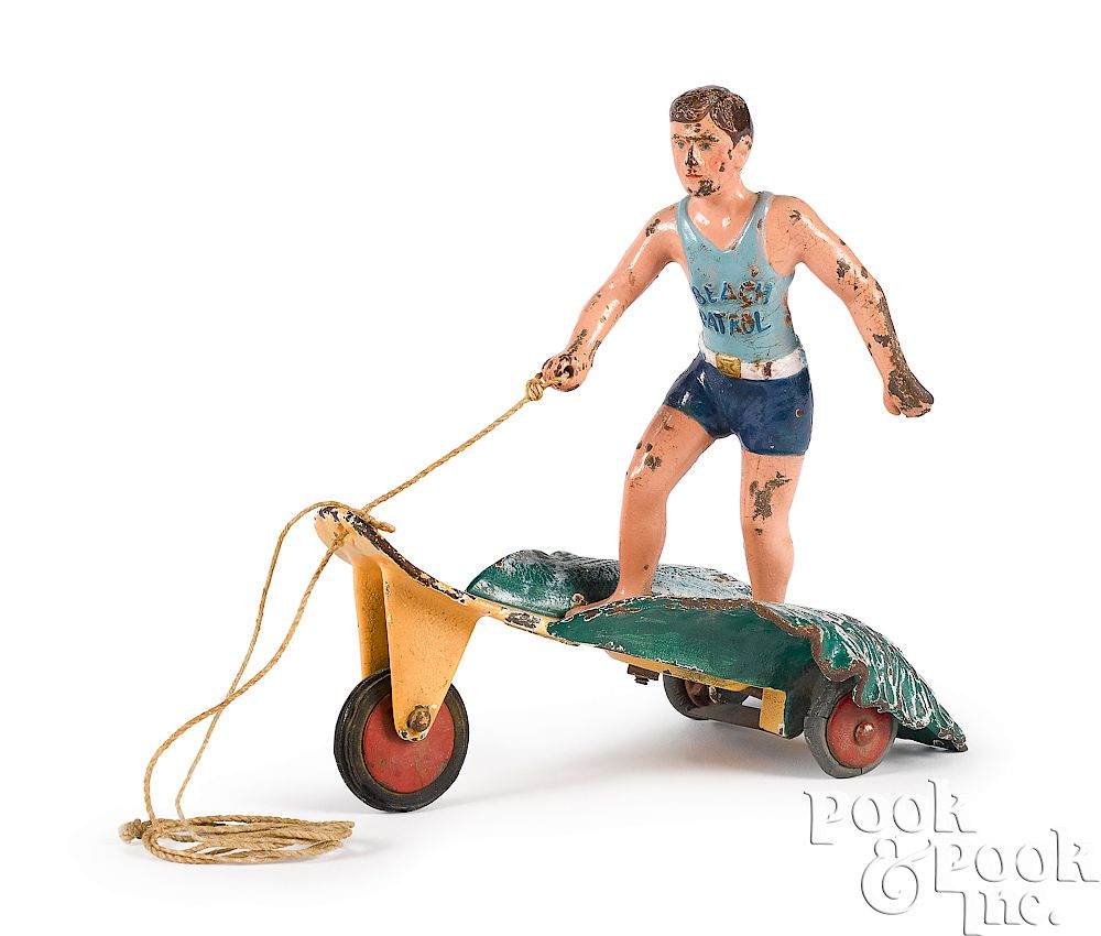 Appraisal: Hubley Beach Patrol surfer boy pull toy Scarce Hubley cast