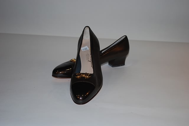 Appraisal: Salvatore Ferragamo bronze leather pumps with darker bronze accent Size