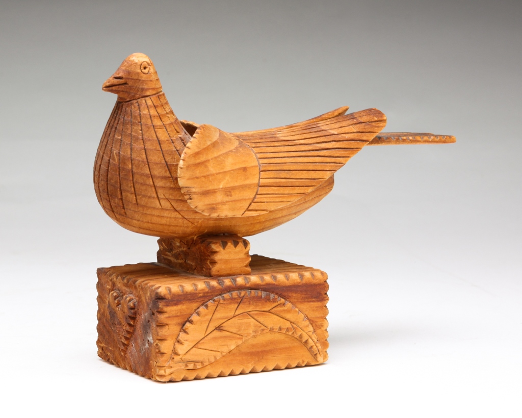 Appraisal: Late th century pine Incised wings and a chip carved