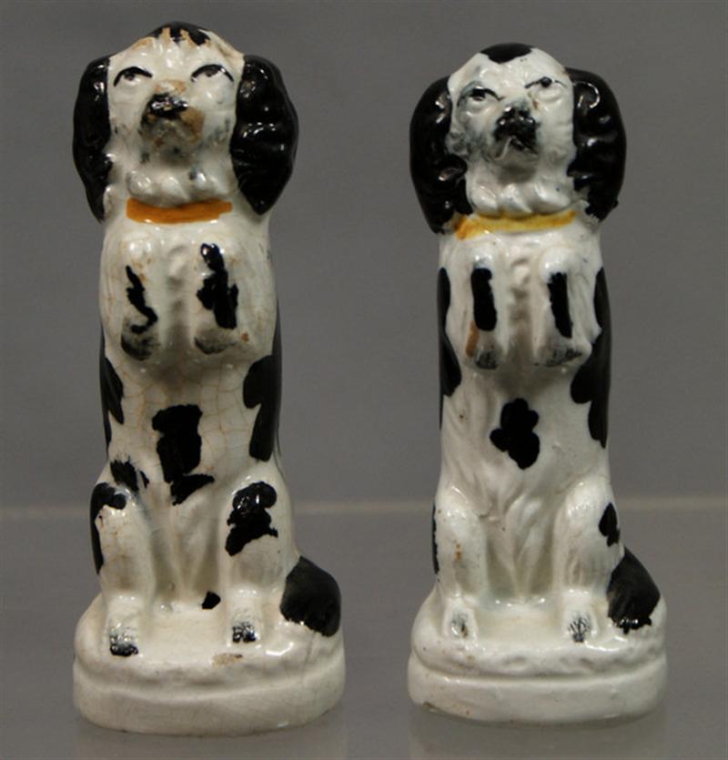 Appraisal: Pr white and black Staffordshire begging spaniels minute glaze flakes