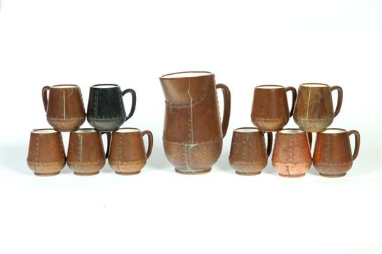 Appraisal: CLEWELL WATER PITCHER AND MUGS Ohio mid th century Copper