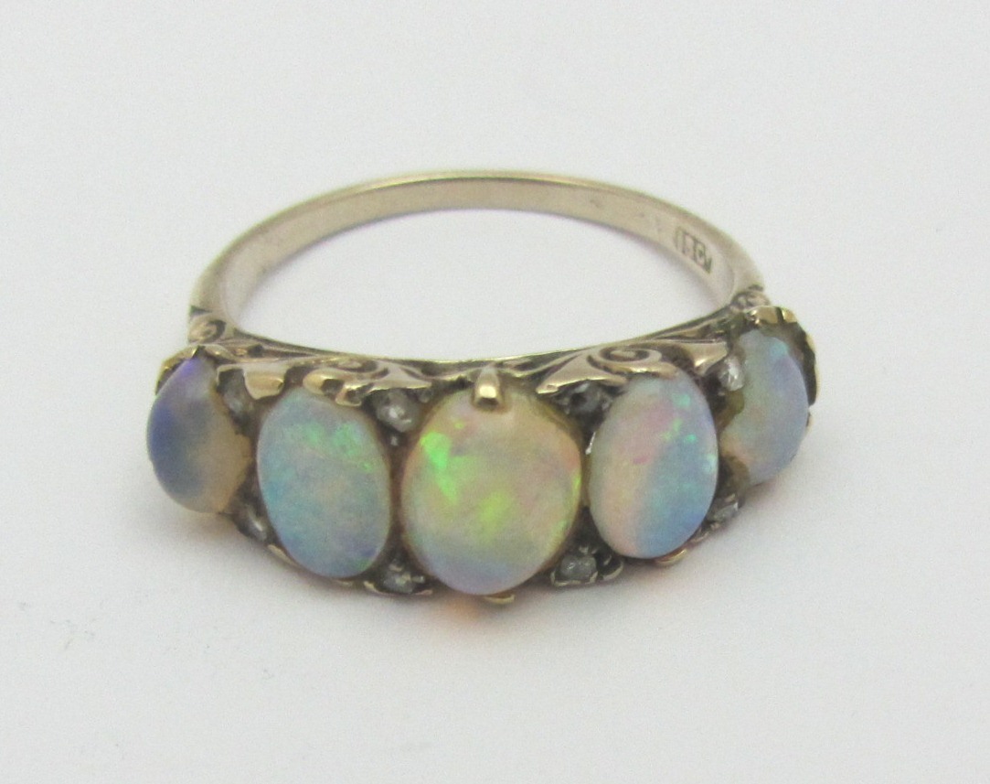 Appraisal: A gold and opal set five stone ring mounted with