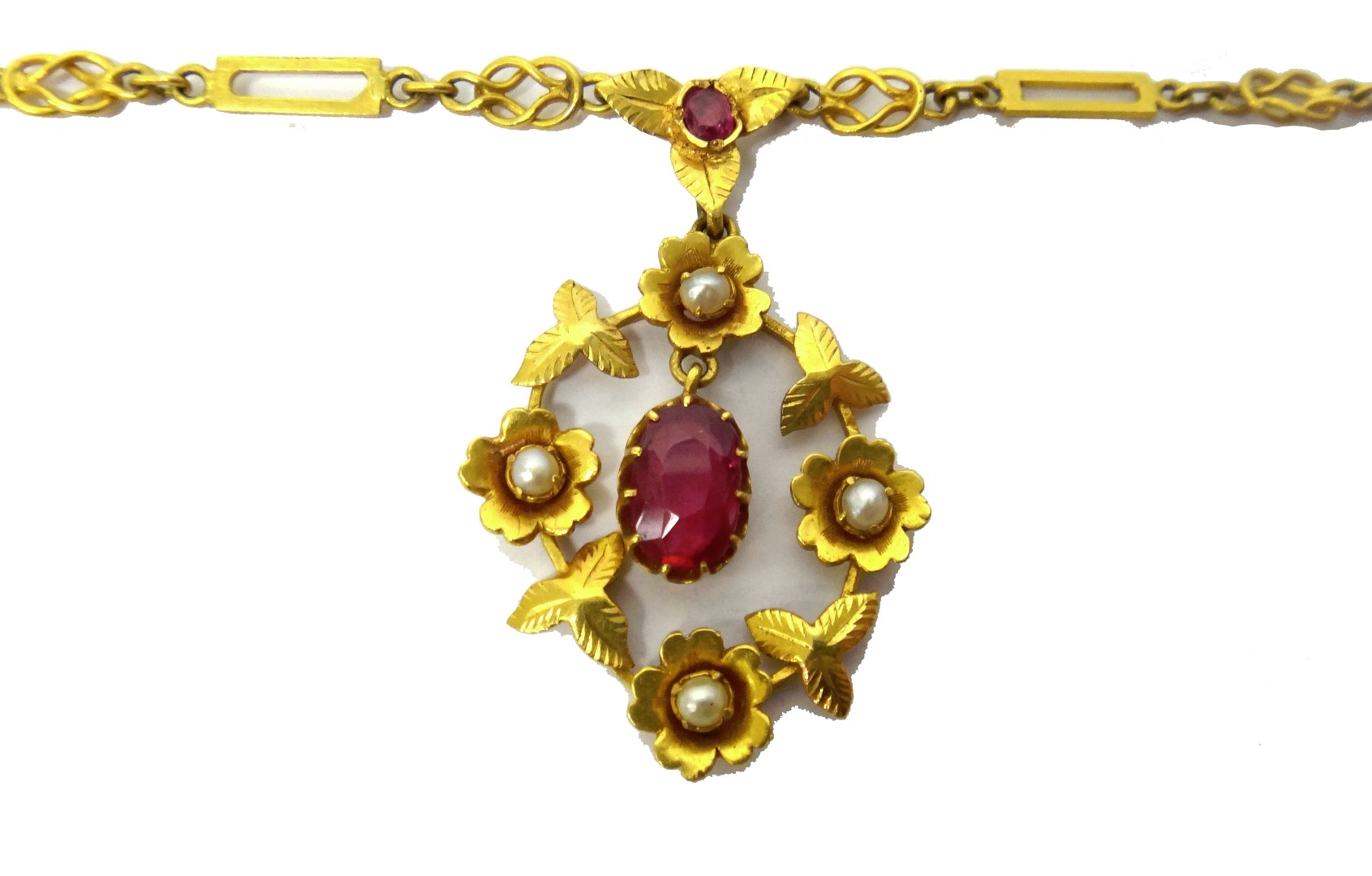 Appraisal: A gold seed pearl and synthetic ruby set pendant necklace