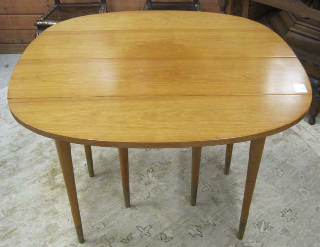 Appraisal: PETITE MAPLE DROP-LEAF DINING TABLE WITH FOUR LEAVES John Widdicomb