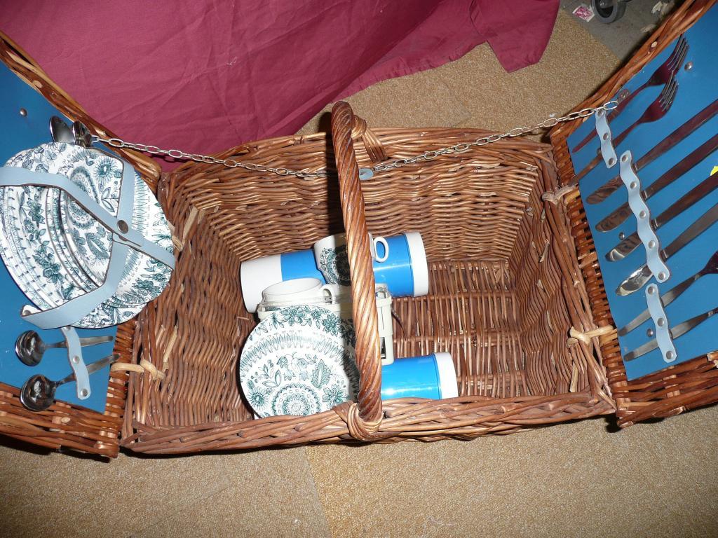 Appraisal: A vintage wicker picnic basket containing set of cutlery two