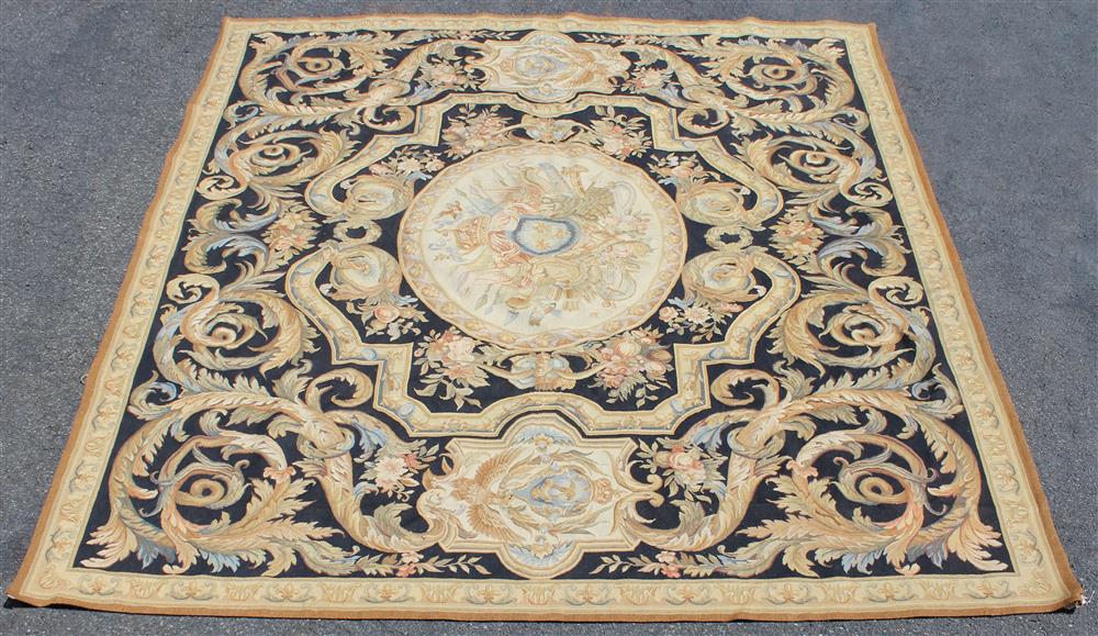 Appraisal: LARGE AUBUSSON DESIGN WOOL RUG central cartouche with scrolling foliate