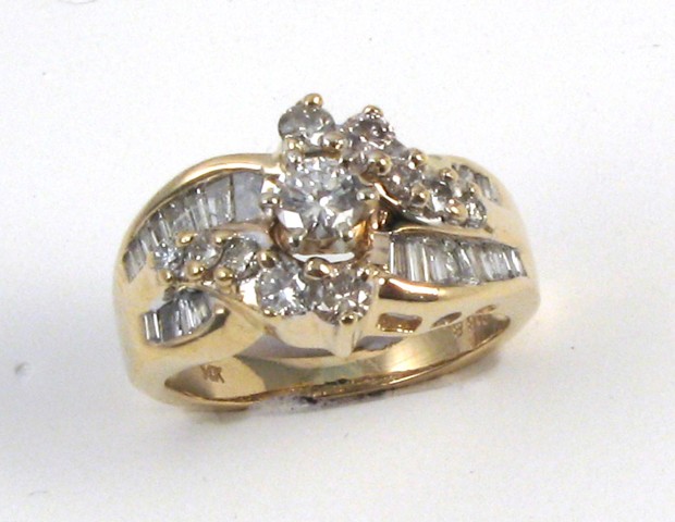 Appraisal: DIAMOND AND FOURTEEN KARAT GOLD RING centering a round-cut diamond