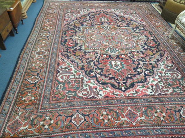 Appraisal: Heriz Persian Room Size Rug grand central design with multiborders