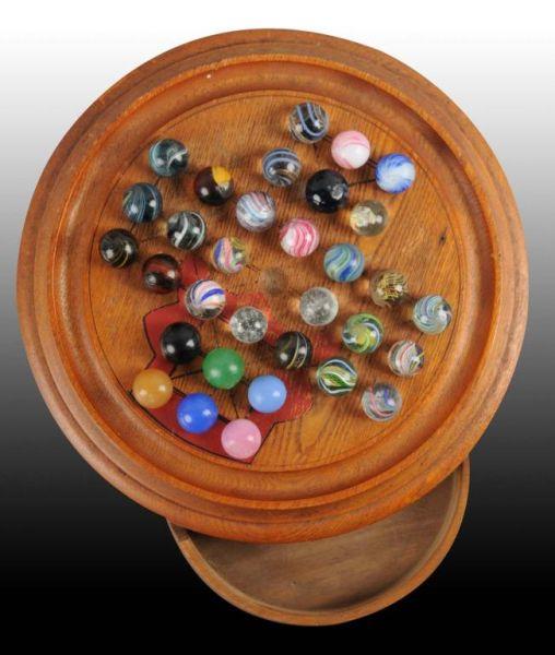 Appraisal: Solitaire Marble Board with Handmade Marbles Description Includes a number