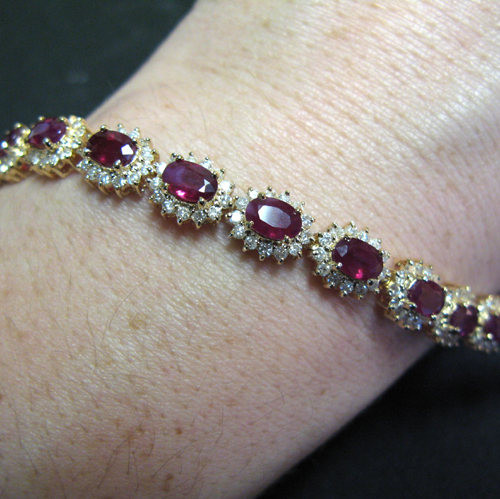 Appraisal: RUBY DIAMOND AND FOURTEEN KARAT GOLD BRACELET set with oval-cut