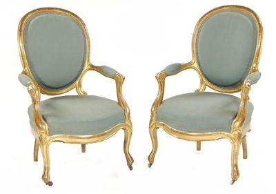 Appraisal: A pair of French giltwood fauteuil with oval padded backs