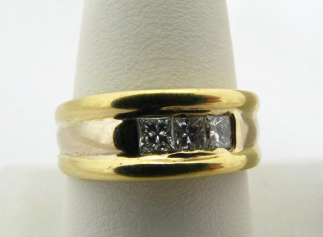 Appraisal: Gent's K yellow gold band set with three princess-cut diamonds